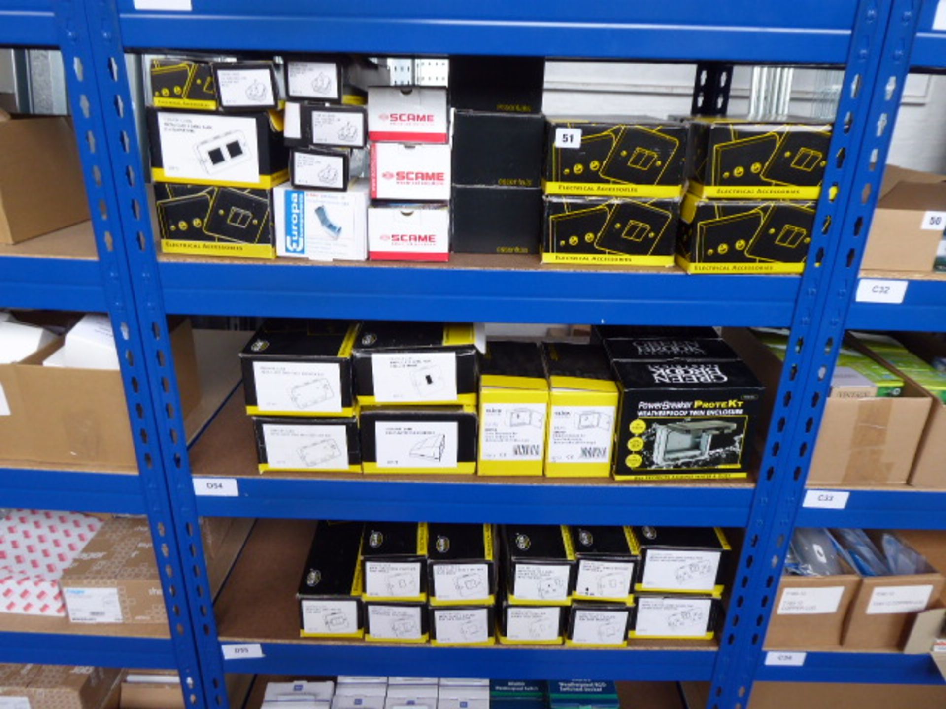 A large quantity of various electrical accessories including 13 amp plugs, socket enclosures,