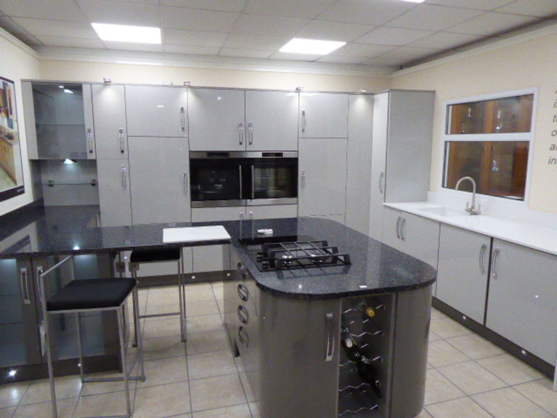 Large Roma dark grey and light grey kitchen with quartz worktops in an L-shape with a breakfast