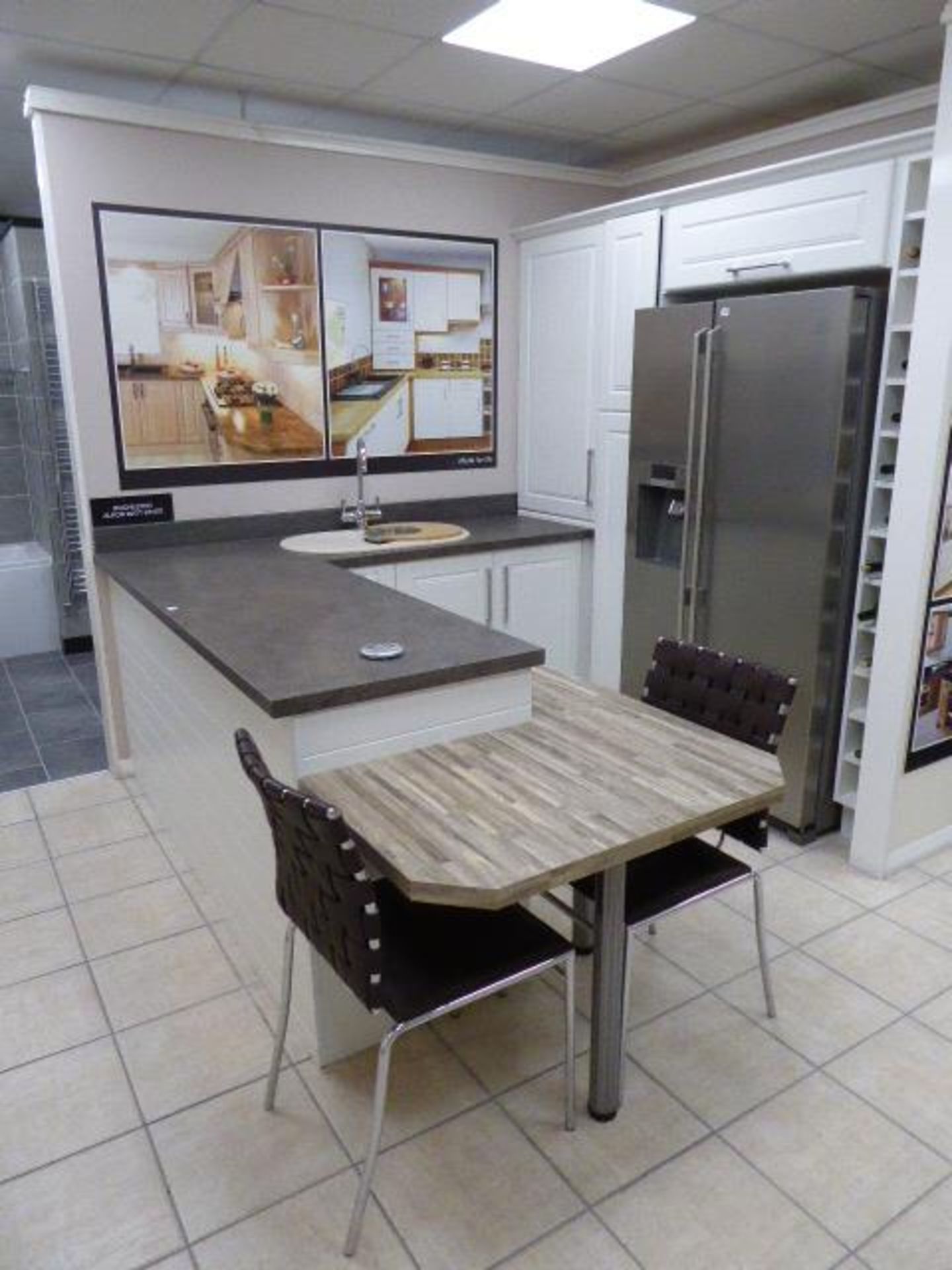 Rochester Alkor matte white kitchen with sand stone effect laminate worktops and block wood effect