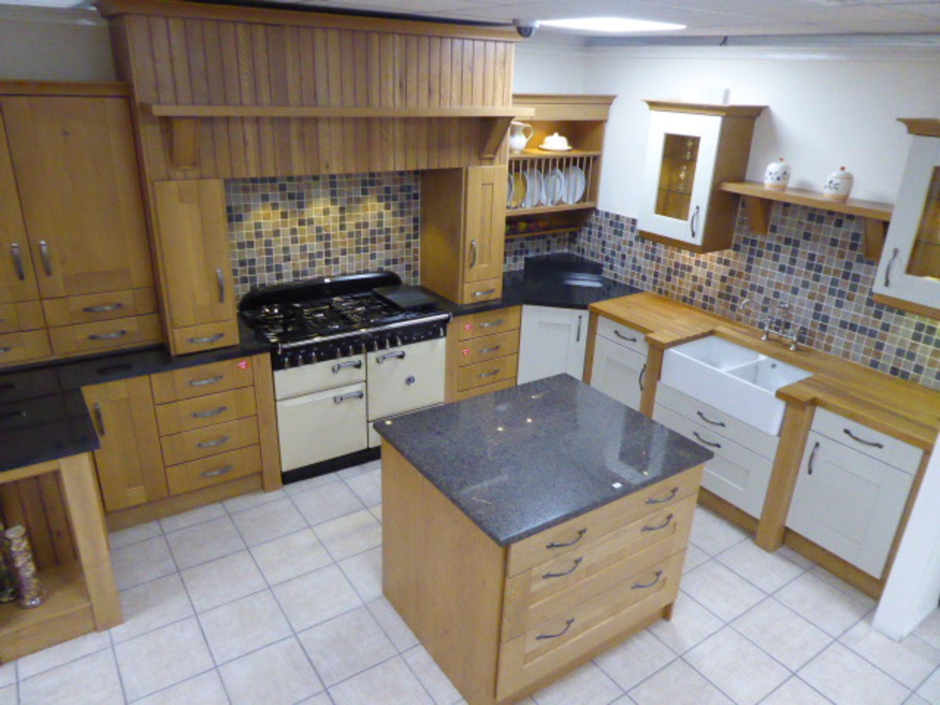 Milbourne almond and Shaker Winchester oak kitchen with stone effect laminate, oak block and granite