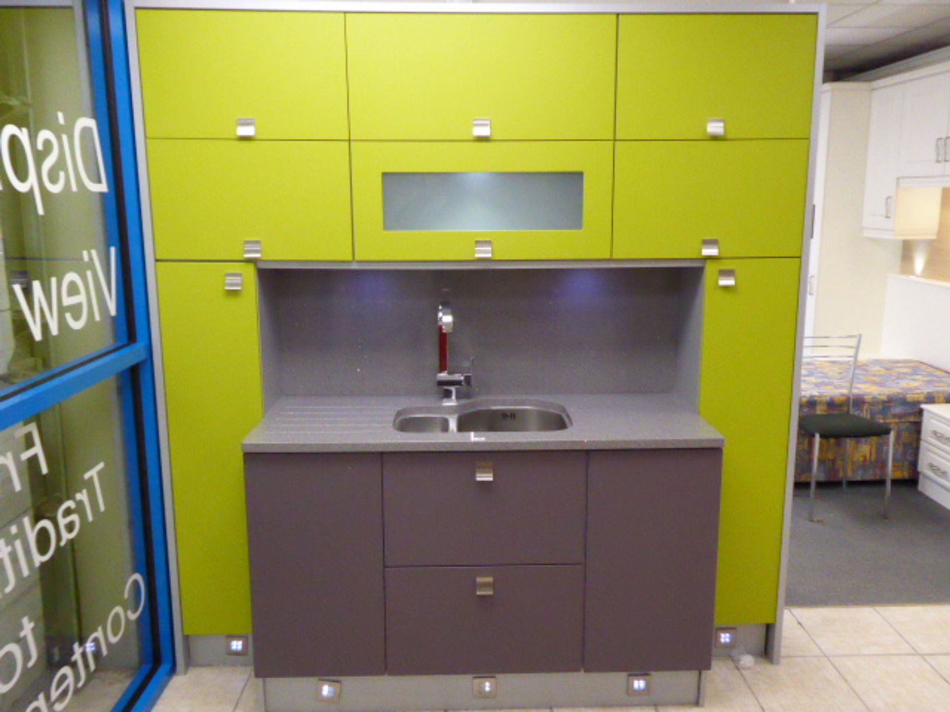 Small Alto textured lime and mulberry part kitchen with quartz worktops. With a stainless steel 1