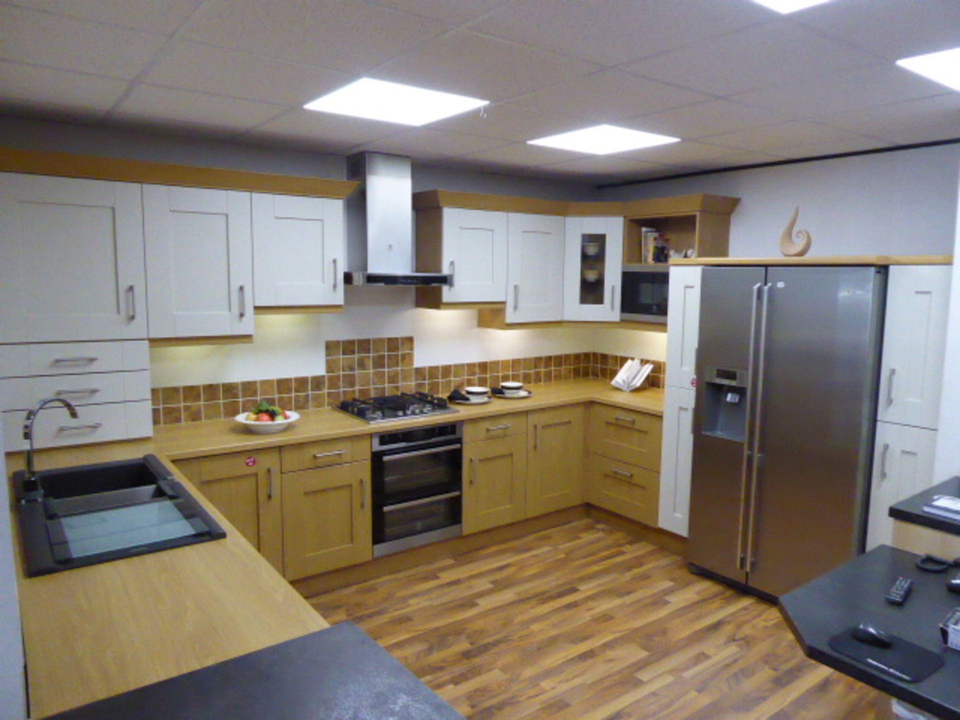 Milbourne oak and almond kitchen with oak effect laminate worktops. Max measurement is 390cm x