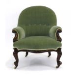 A Victorian button upholstered lowback nursing chair with mahogany scrolled arms and front legs,