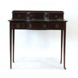 A late 19th/early 20th century mahogany and strung bonheur de jour,