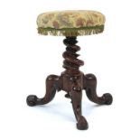 A Victorian mahogany piano stool with an adjustable shaft and later upholstered seat