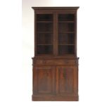 A Regency bookcase cabinet, the pair of doors enclosing shelves,