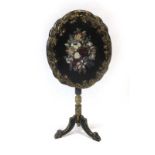 A papier mache tilt-top wine table decorated in the chinoiserie manner CONDITION REPORT: