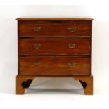 A late Georgian mahogany chest of three long graduated drawers, on later bracket feet, w.