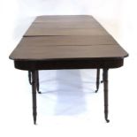 A 19th century mahogany extending dining table, with two D-ends,