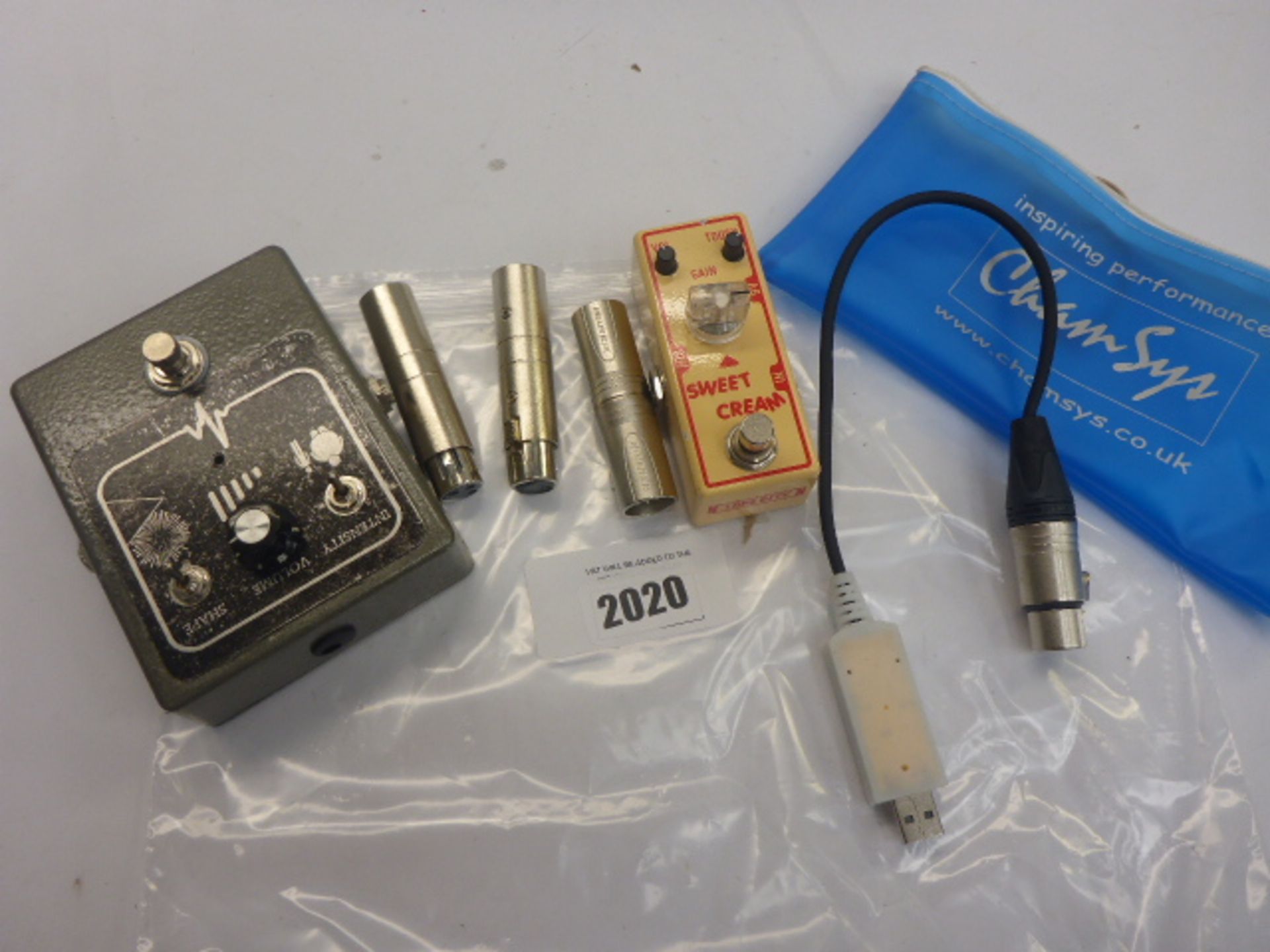 2 guitar pedals and microphone adapters
