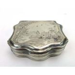 A Dutch silver and parcel gilt hinged snuff box of scalloped form,