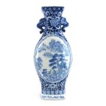 A Chinese blue and white moon-type flask of elongated form,