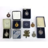 A group of sporting medallians including five silver, one base metal and a 9ct gold example,