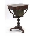 A Victorian rosewood and strung sewing/hobby table on a turned column and three scrolled feet, w.