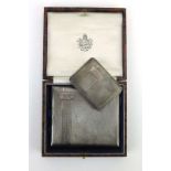 Of Military Interest: A silver, parcel gilt and engine turned cigarette case and matching vesta,