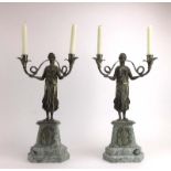 A pair of silver-plated figural two-branch candlesticks modelled as classical ladies,