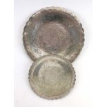 A graduated pair of Middle Eastern metalware plates, max d. 22 cm, overall 11.