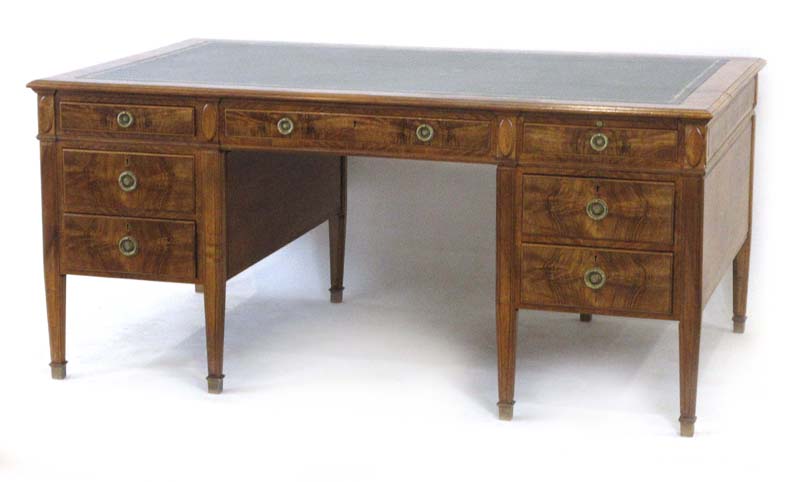 A 20th century walnut twin pedestal partner's desk,