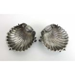 A pair of Victorian silver salts of shell form, each on three stylised dolphin feet, Thomas Smily,