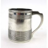 A George III silver Christening mug of tapered form with reeded belly and plain handle, maker SH,