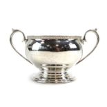 A silver two handled sugar bowl of vase shaped form, maker WB, Sheffield 1943, w. 15.5 cm, 7.