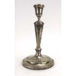 A silver candlestick of knopped form, maker ETB & S, London 1954, h.