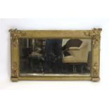 A William IV giltwood overnmantle mirror with relief foliate decoration,