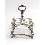 A George IV silver four section condiments stand with gadrooned and scrolled decoration,