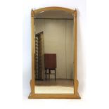 A late 19th/early 20th century giltwood overmantle mirror with a bevelled glass plate,