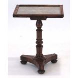 A 19th century rosewood occasional table with an embroidered and silver thread surface on a turned