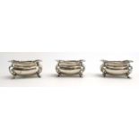 A set of three silver salts of boat shaped form on outswept feet, w.