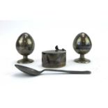 A pair of metalware and niello enamelled peppers of ovoid form,