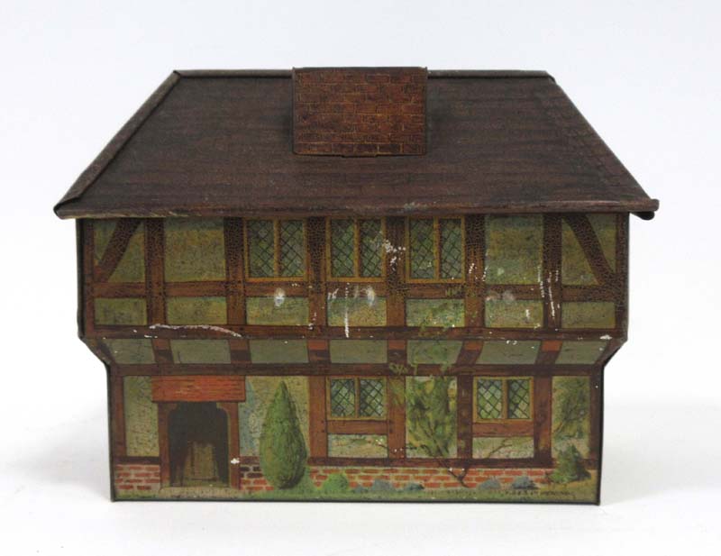 An early 20th century Hudson Scott money box in the form of a Tudor house