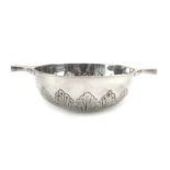 A late Victorian silver two handled quaich of oversized proportions,