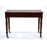 A Victorian mahogany three-drawer side table on turned legs, w.