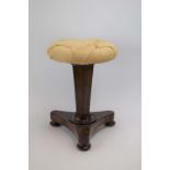 A 19th century rosewood adjustable stool on a hexagonal column,