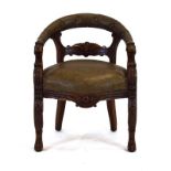 A Victorian carved oak gentleman's armchair with figural arms and legs,