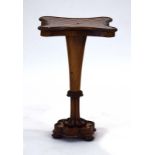 A Regency rosewood and walnut games table, the marquetry chessboard surface with a shaped surround,