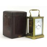 A late 19th century carriage timepiece with a brass and five-glass case, h.