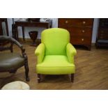 A Victorian mahogany armchair with later lime green silk upholstery