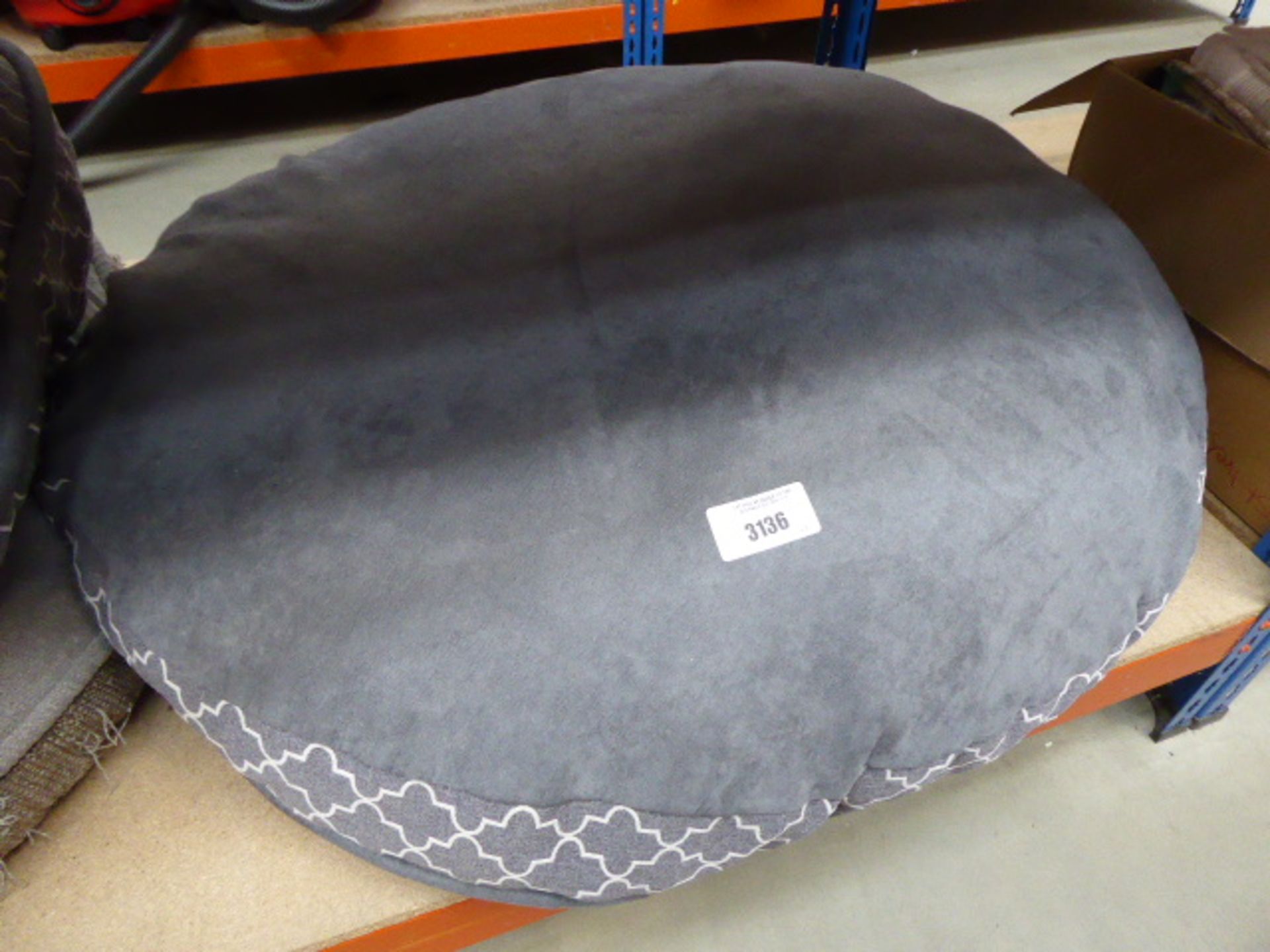 A large circular dog bed