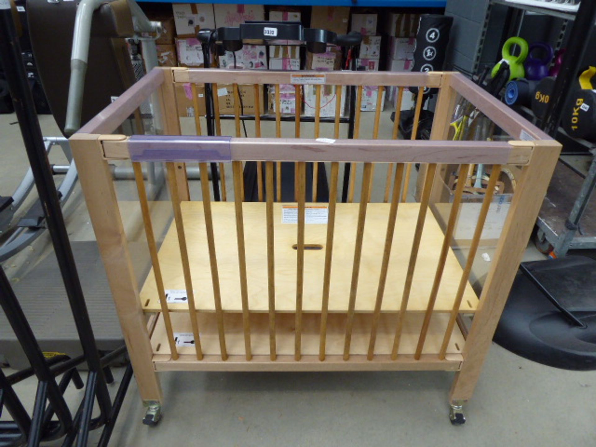 3434 Child's wooden wheeled cot