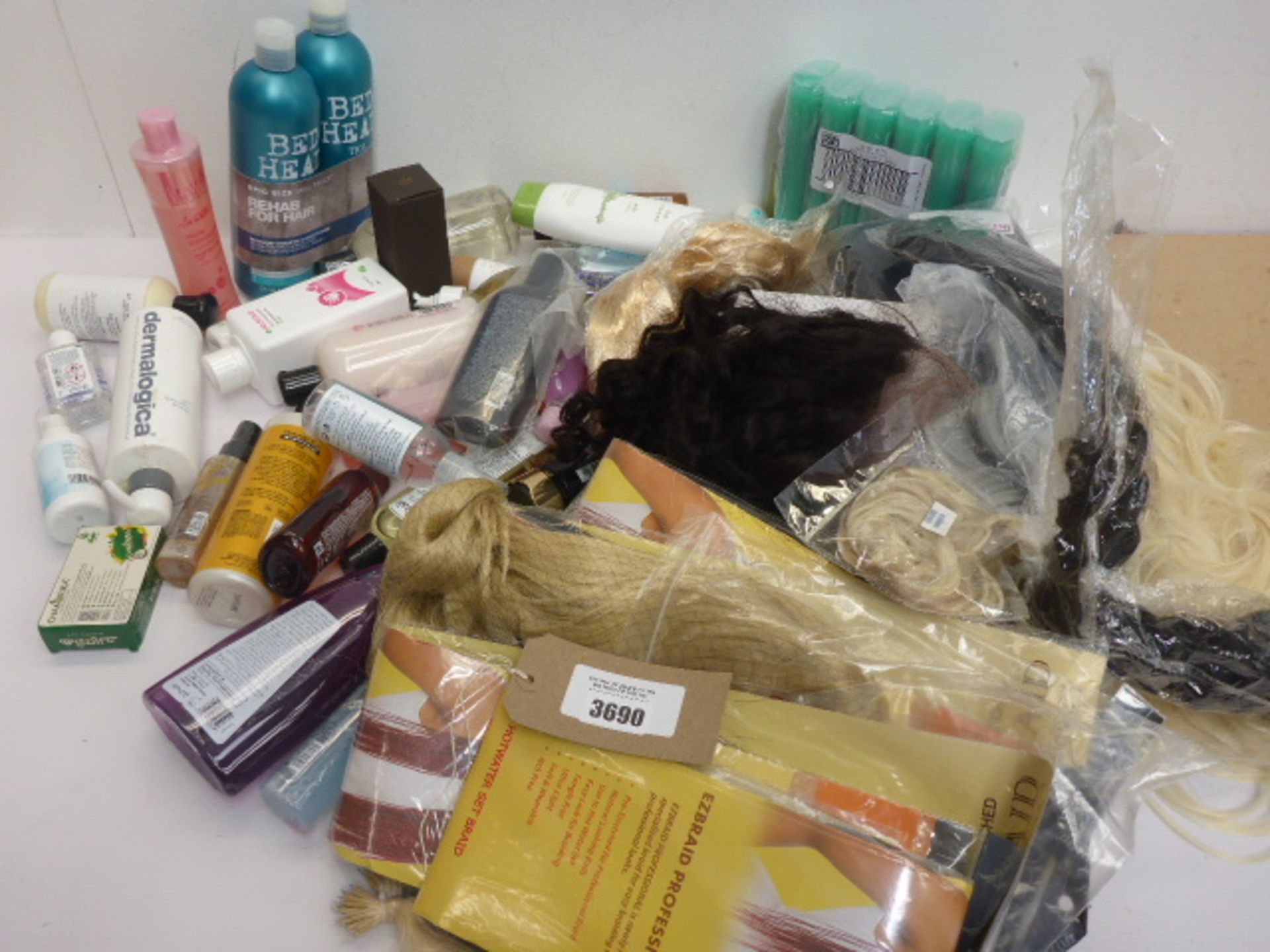 Bag containing wigs, hair pieces, shampoo, conditioner, body wash and other toiletries