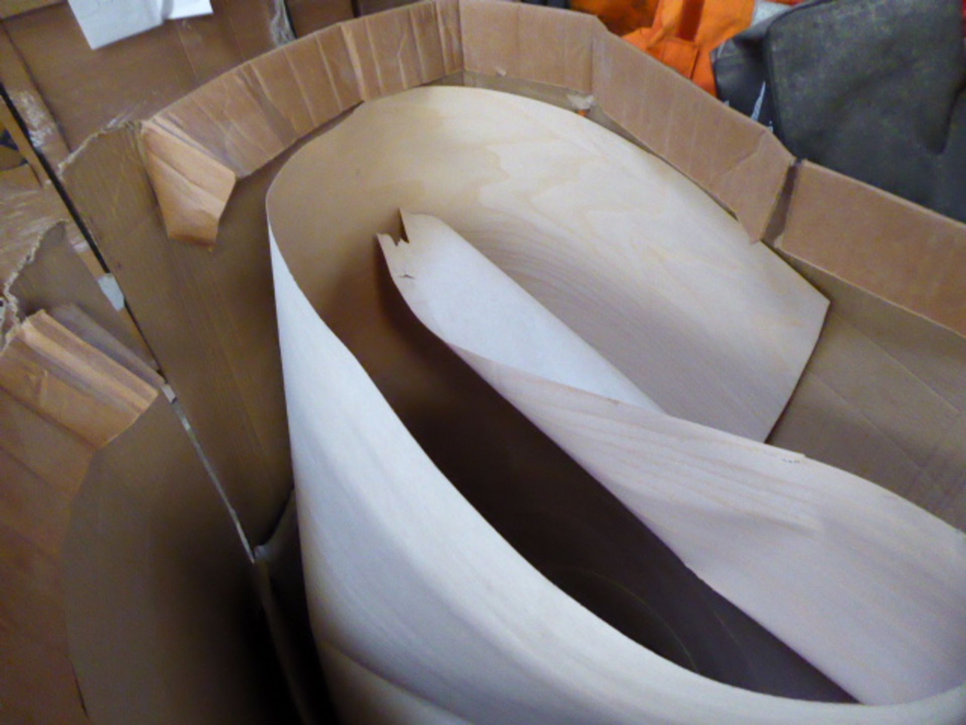 Large box containing roll of veneer