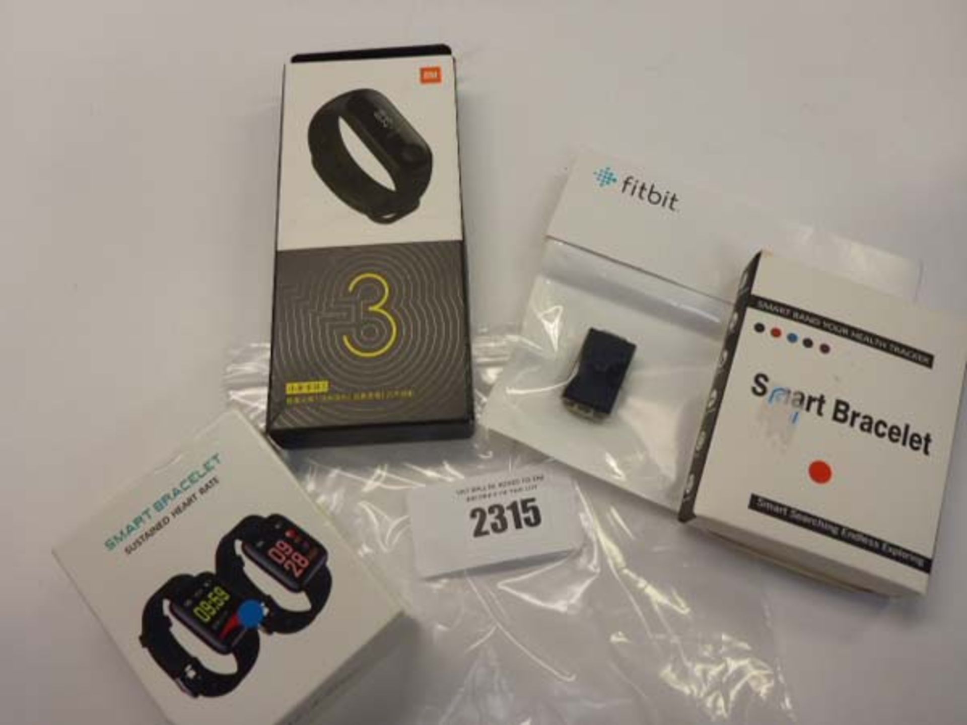 Quantity of various smart/activity bracelets