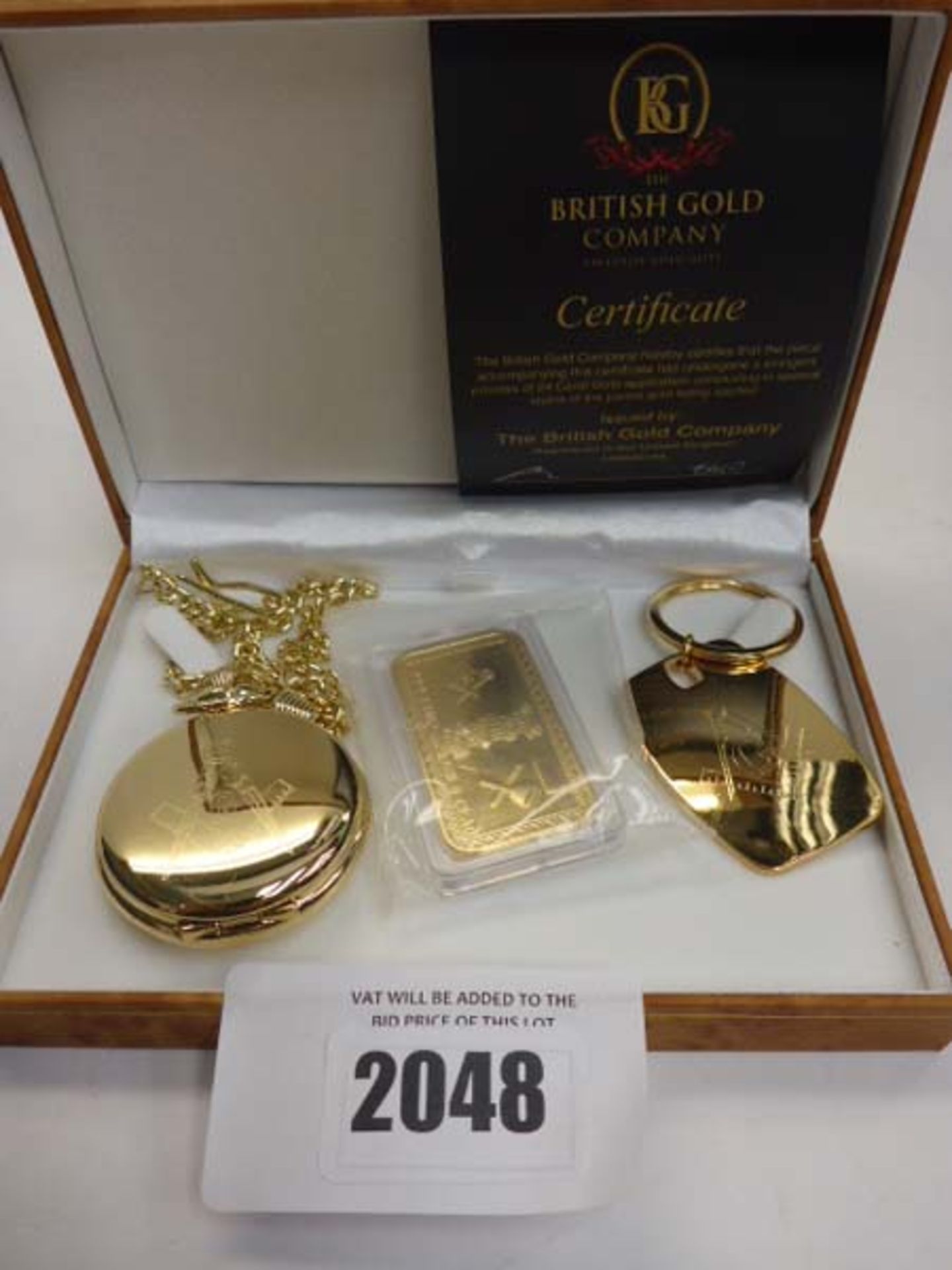 Set of Masonic themed gold clad items; pocket watch, keyring and ingot