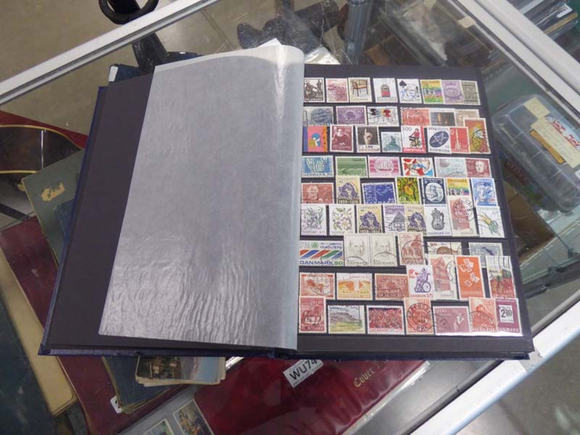 Blue collectors stock book with a collection of world stamps