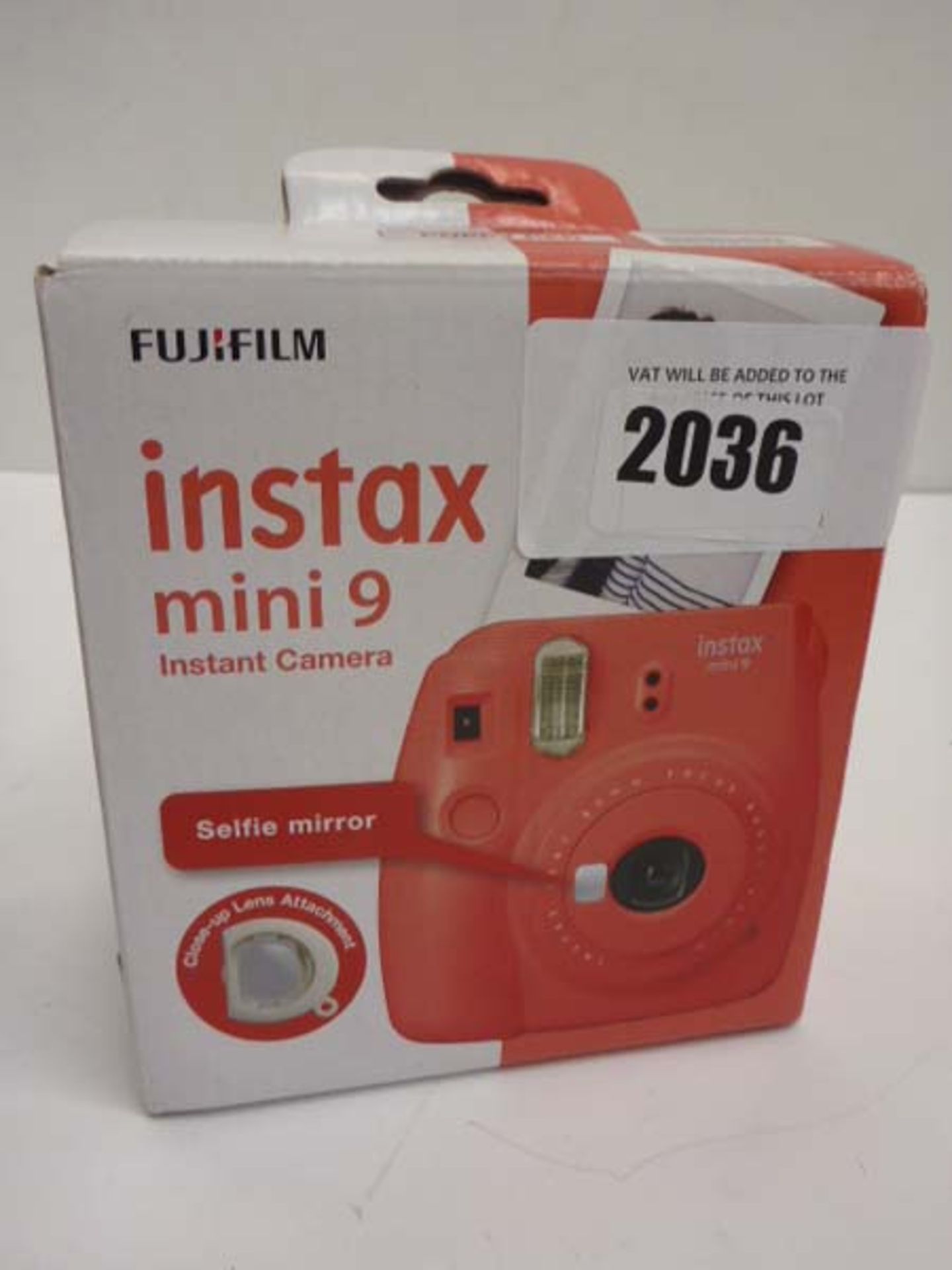 Fujifilm Instax Mini 9 instant camera in red