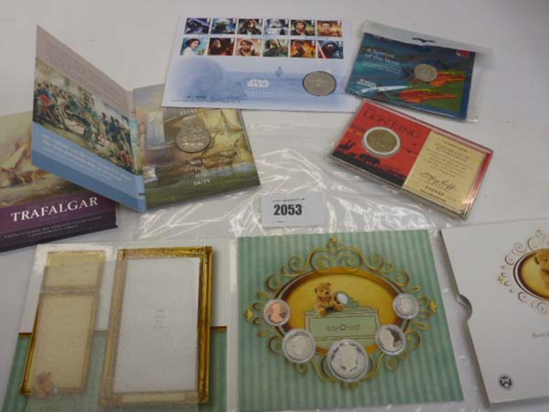 Quantity of TV and historical themed collectable coins in cases/folders