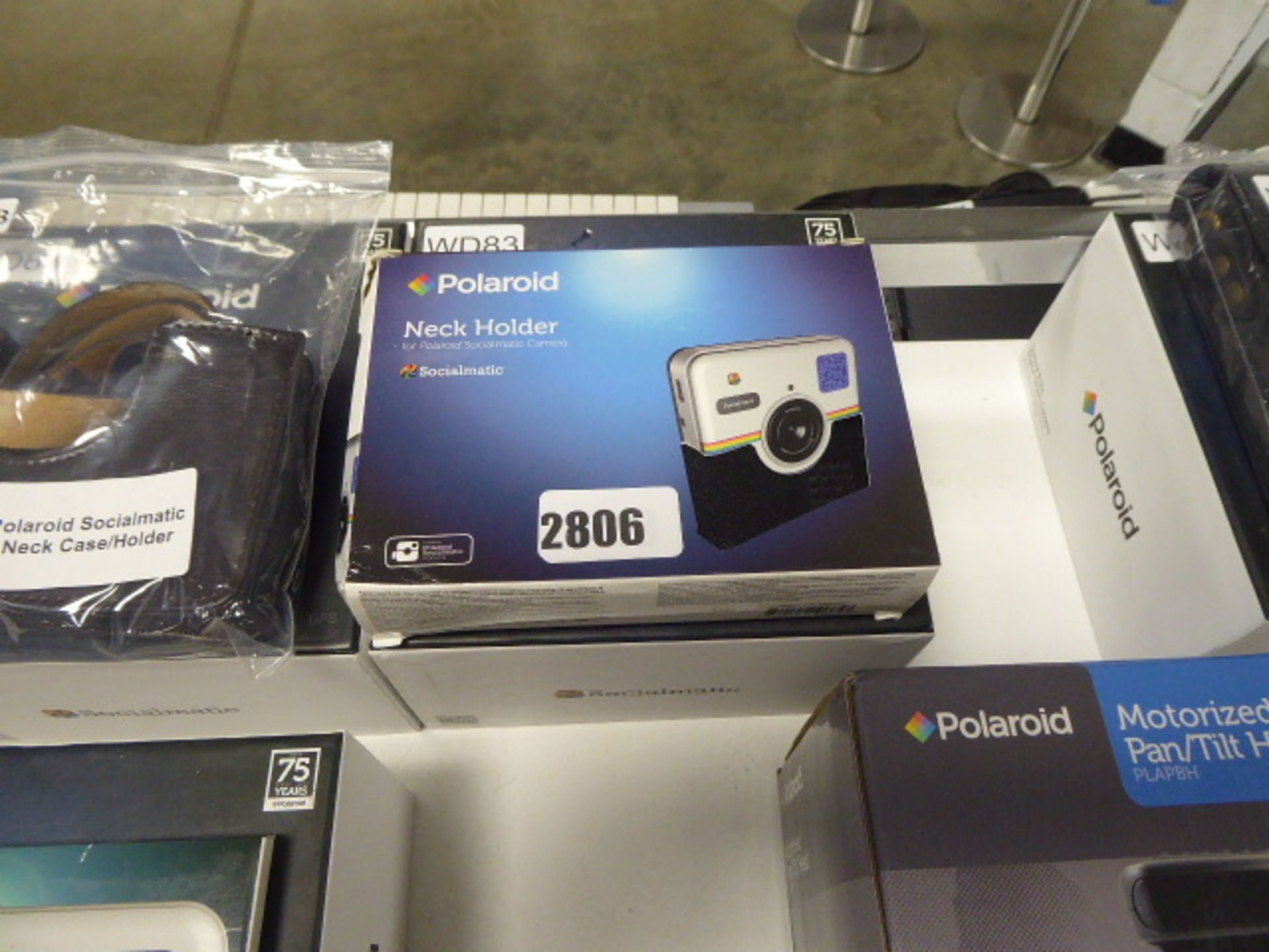 (2719) Polaroid Socialmatic camera with neck case holder.